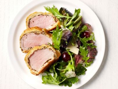 Pork Wellington with greens and grapes