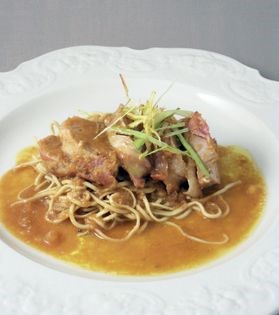 Pork with ginger butter sauce and noodles