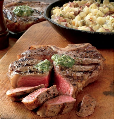 Porterhouse steaks and smashed potatoes with garlic butter