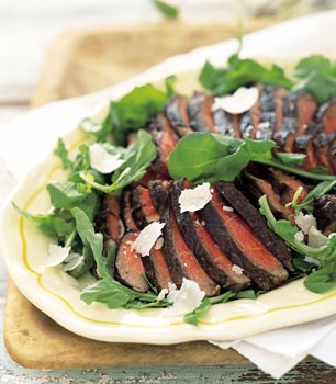 Porterhouse steaks with arugula and Parmesan cheese
