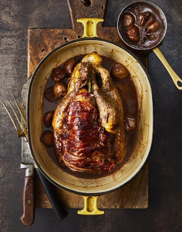 Pot-roast guinea fowl with chestnuts and spiced gravy 