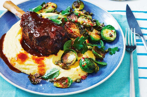 Pot-roasted lamb shanks with polenta and sprouts