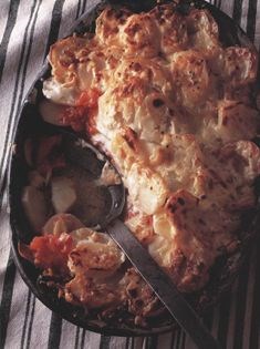 Potato and tomato gratinée with anchovies and yogurt