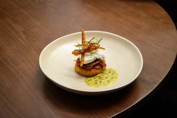 Potato cake, maple-glazed ham hock, crispy potato skins and mustard dressing