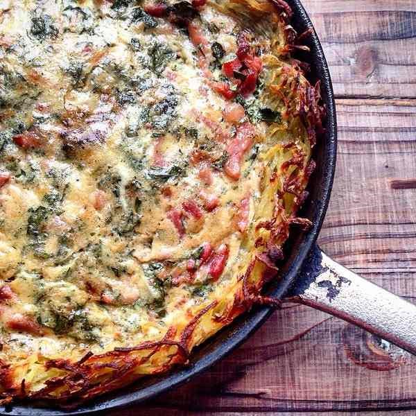 Potato crust quiche with lardons, creme fraiche and marjoram