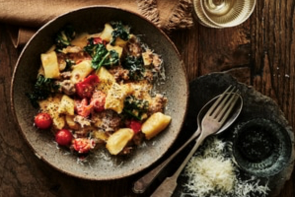 Potato gnocchi with pork sausage, cavolo nero and cherry tomato sauce