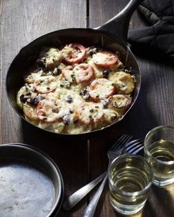 Potato gratin with tomato, olive, and capers