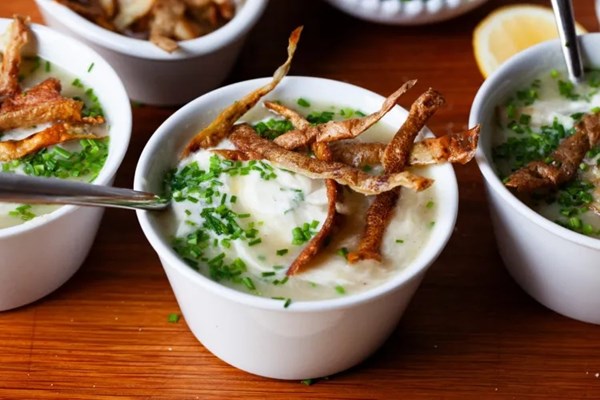 Potato leek soup with crispy skins, sour cream, and a lot of chives