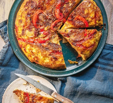 Potato omelette with caramelised red onion and red pepper