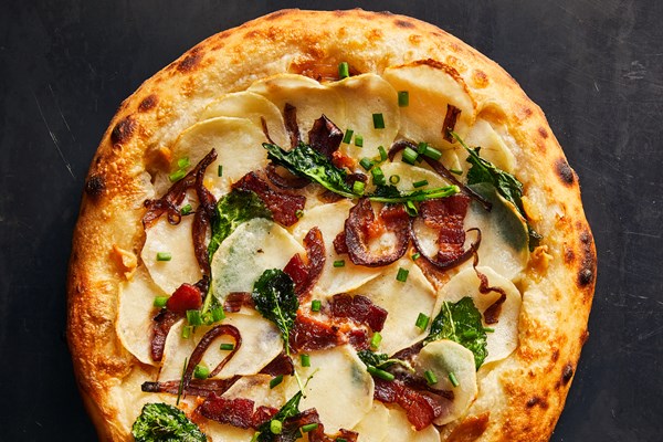 Potato pizza with crème fraîche and bacon