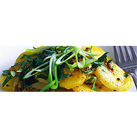 Potato salad with curry vinaigrette, green onions and coriander
