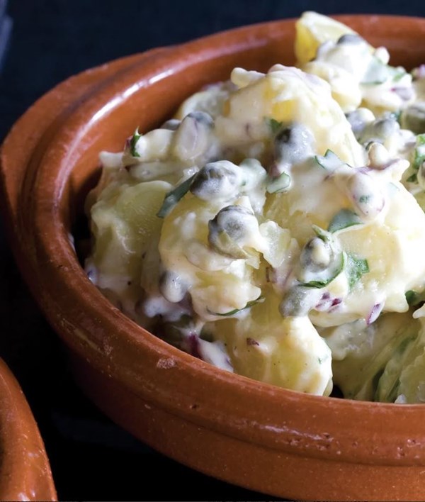 Potato salad with green olives, shallots and sweet herbs