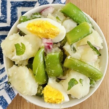 Potato salad with mint and sugar snap peas