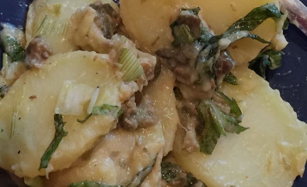 Potato salad with spring onions, capers, and mint