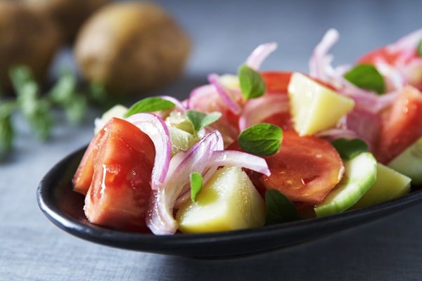 Potato salad with tomatoes and sardines from Naxos (Patatosalata me sardeles apo tin Naxo)