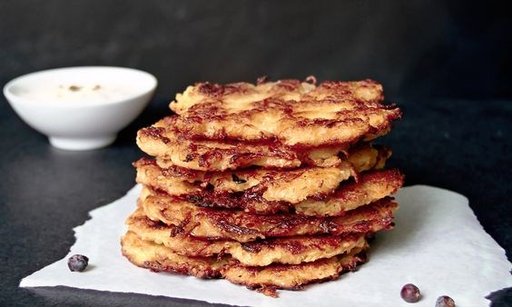 Potato-sauerkraut latkes with juniper sour cream dip