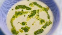 Potato soup with kale and hazelnut pesto