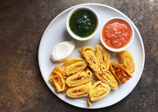 Potato spirals with tomato salsa and creme fraiche