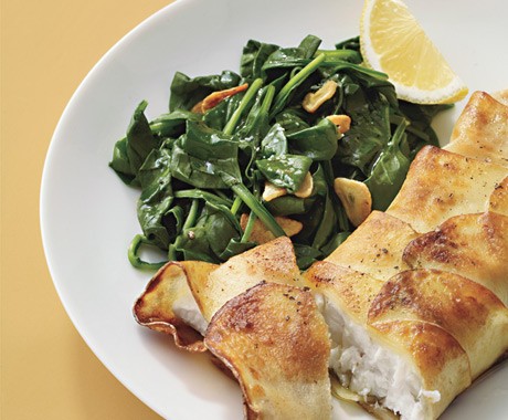 Potato-wrapped halibut with sautéed spinach