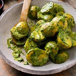 Potatoes with green tahini sauce