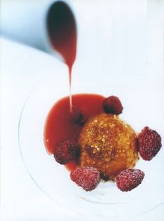 Praline-coated milk and honey ice cream with strawberry soup