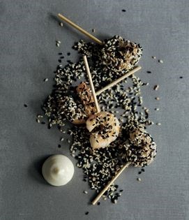 Prawn on a stick with black and white sesame