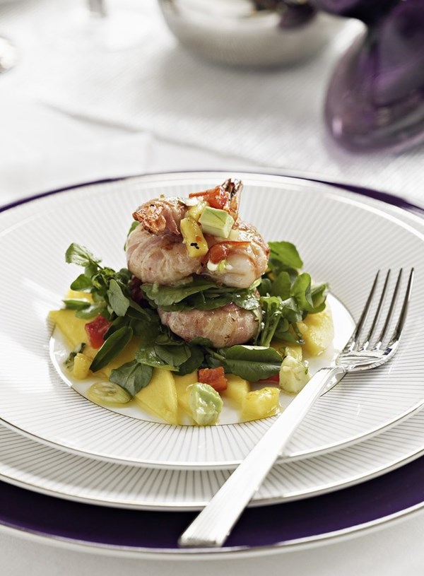 Prawns in bacon with mango and avocado salad