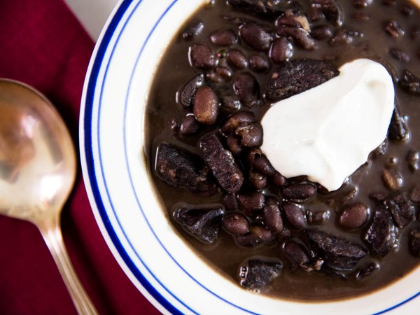 Pressure cooker black bean soup with sausage and cumin-lime sour cream