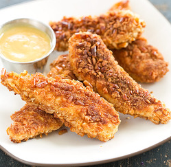 Pretzel-crusted chicken fingers with honey mustard