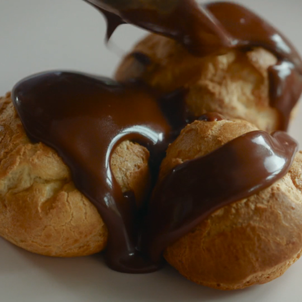 Profiteroles with dark chocolate sauce