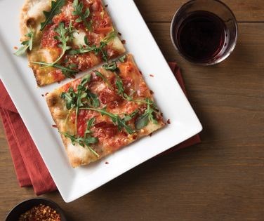 Prosciutto and arugula [pizza]