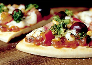 Prosciutto, basil and mozzarella pizza