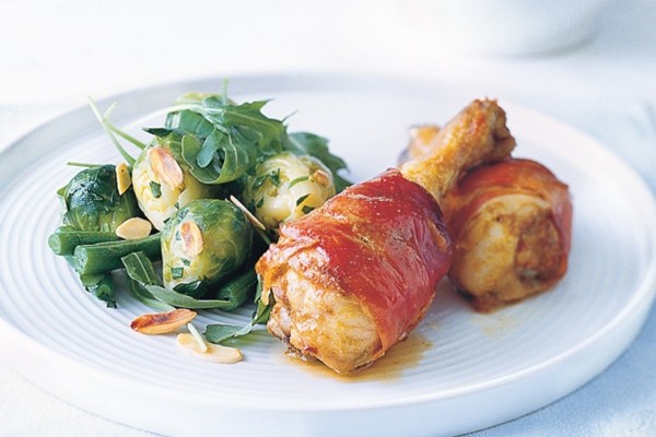 Prosciutto chicken drumsticks with buttered Brussels sprouts