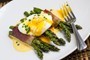 Prosciutto wrapped asparagus with poached egg and Hollandaise sauce