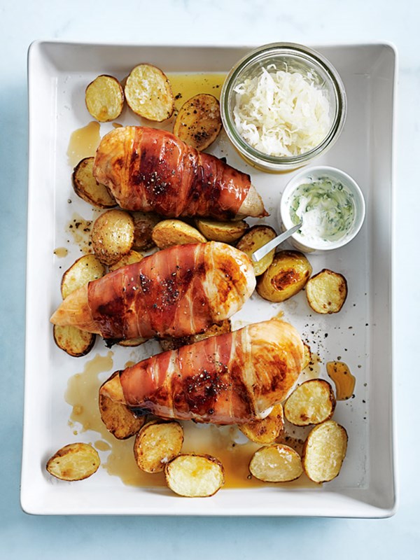 Prosciutto-wrapped chicken with herbed sour cream and crispy potatoes