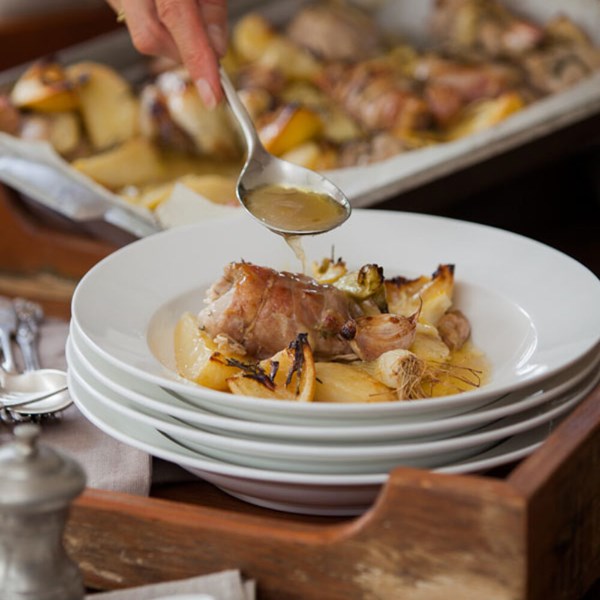 Prosciutto-wrapped chicken with lemons, spring onions and potatoes