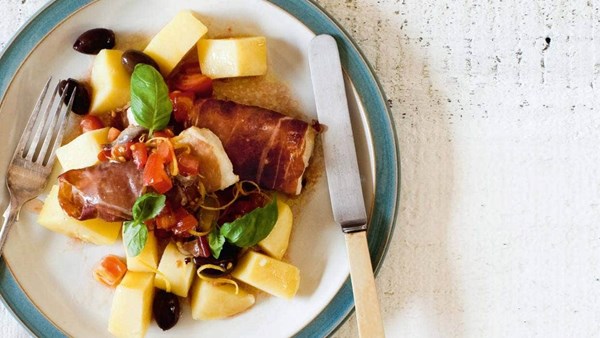 Prosciutto-wrapped monkfish with tomato anchovy vinaigrette