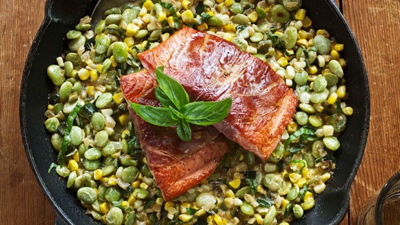 Prosciutto-wrapped salmon with corn and poblano succotash