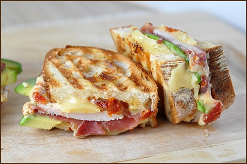 Prosciutto-wrapped turkey, avocado and Swiss panini