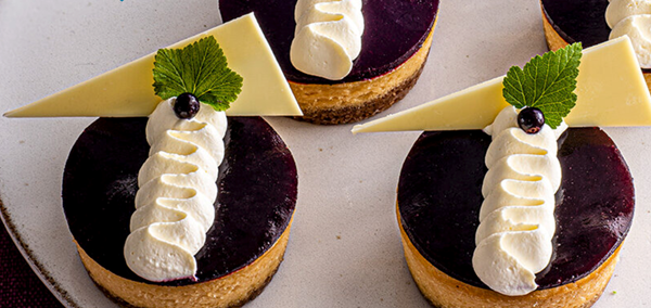 Prue's caramelised white chocolate & blackcurrant cheesecakes