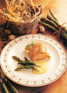 Puff pastry of quails' eggs and asparagus with herb and cream sauce