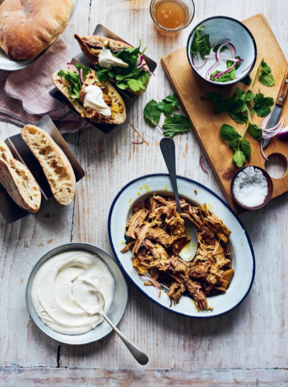 Pulled lamb shawarma with tahini and yoghurt dressing and herb salad