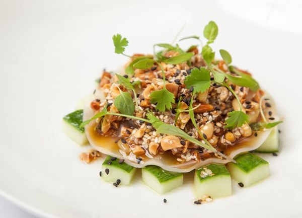 Pulled pork and chorizo "raviolo', pickled cucumber, sesame peanut and green chilli