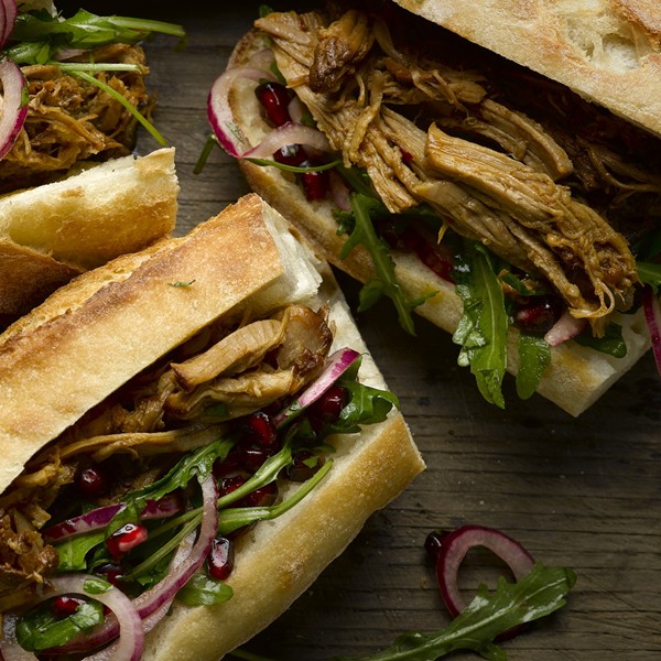 Pulled pork sandwich with pomegranate salad