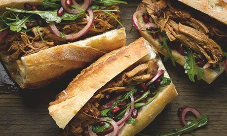 Pulled pork sandwich with pomegranate salad