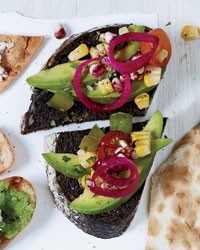Pumpernickel with avocado, charred corn and tomato