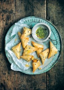Pumpkin & feta triangles with mint dipping sauce