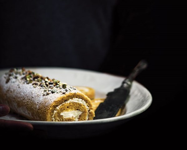 Pumpkin cake roll with orange blossom crème fraîche and pistachios