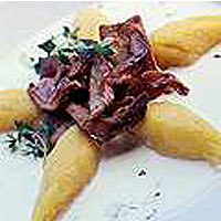 Pumpkin gnocchi garnished with wood blewits 