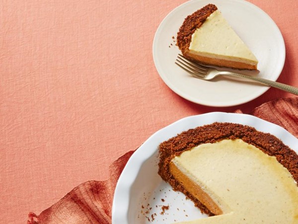 Pumpkin pie with gingersnap crust and rum cheesecake topping 